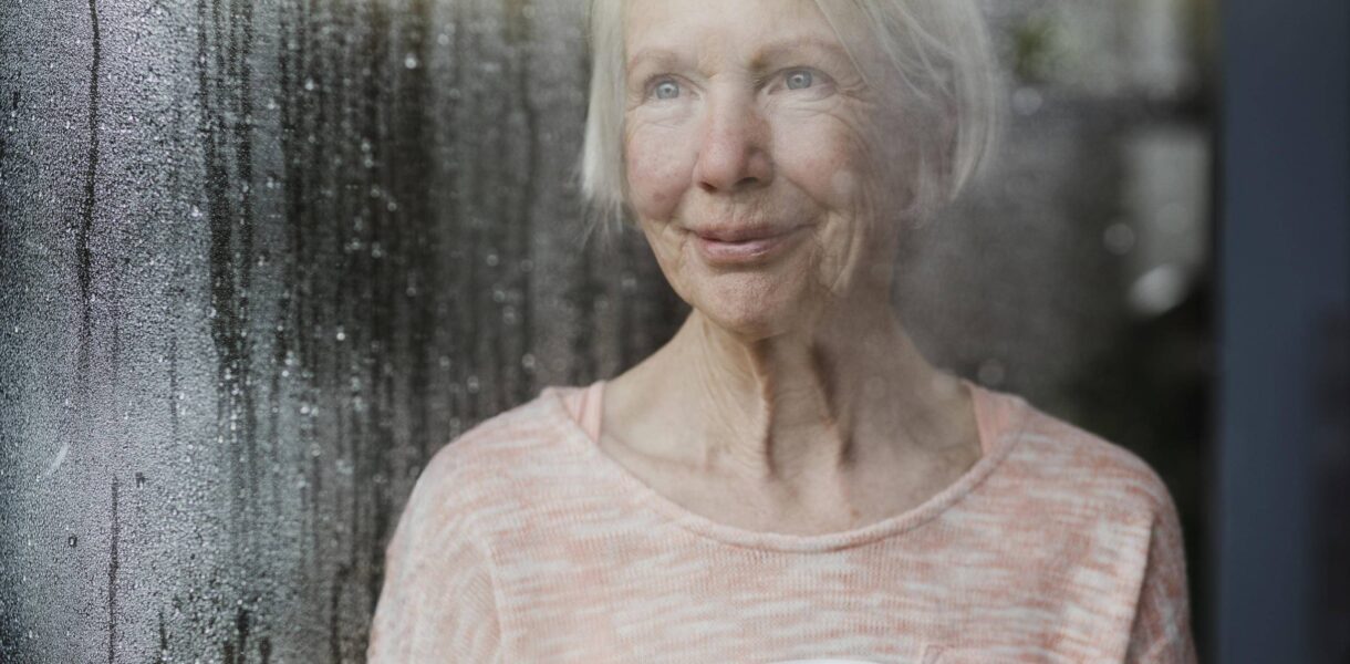 Senior Woman Enjoying The Rain