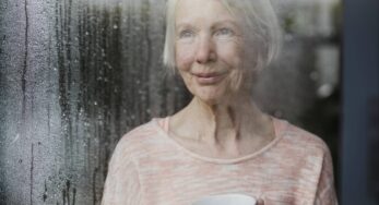 Senior Woman Enjoying The Rain