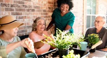 group of seniors gardening at avalon memory care